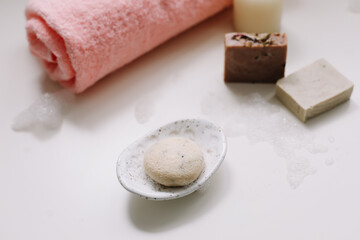 Fototapeta na wymiar Handmade soap with bath and spa accessories. Vegan handmade natural bar soaps. spa and wellness products