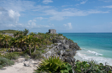 Cliff and at Tulum Yucatan Mexico with Mayan Temple - 577339604