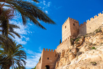 Beautifu castle walls and palm tree gardens at the Conjunto Monumental de la Alcazaba de Almería