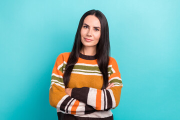 Fototapeta premium Portrait of young serious confident business lady casual trendy striped sweater professional seo company worker isolated on cyan color background