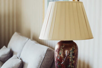 Antique table lamp in the classic English countryside interior decor.