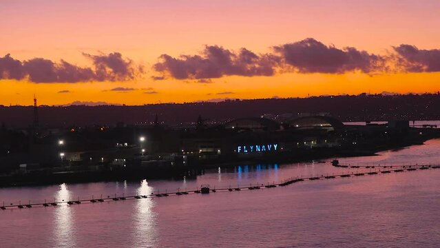 Colorful sunset overlooking San Diego naval base and Coronado island