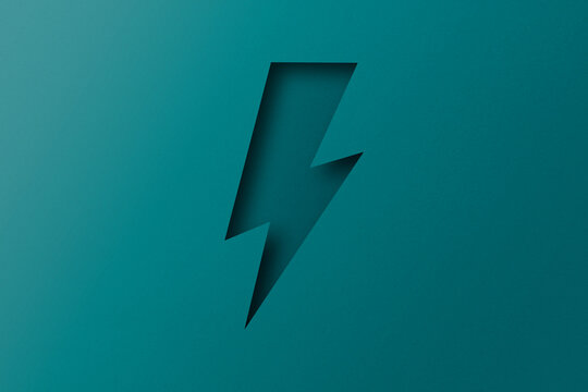 green paper cut into holes Lightning bolts are overlaid with light and shadow.