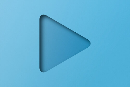 light blue paper cut into holes Triangular shapes are overlaid with light and shadow.