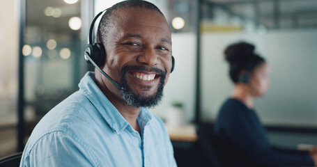 Call center, customer support and face of black man at desk working on computer, online and...