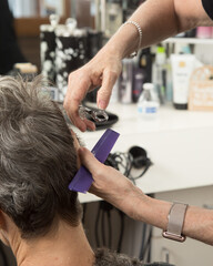 Closeup of Stylist Trimming Hair