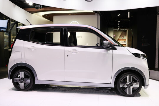 TOKYO, JAPAN - November 2, 2022: A Nissan Sakura, a battery electric kei car, on display in a Nissan showroom in Tokyo's Ginza area.