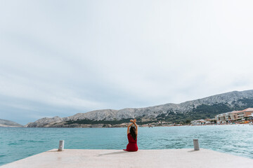 girl on the pier near the sea