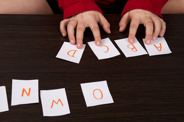 Obraz premium English alphabet cards. The child learns letters. Education in kindergarten. Elementary School. Learning to read