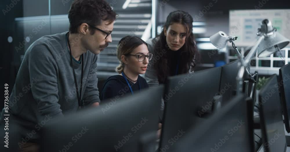 Aufkleber Team of Three Talented Young Software Engineers Use Computer to Discuss a Technological Project in Modern Industrial Office. Group of Male and Female Scientists Work in Research and Development Center