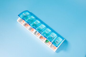 Plastic container for storing pills. Organization of storage of tablets for each day