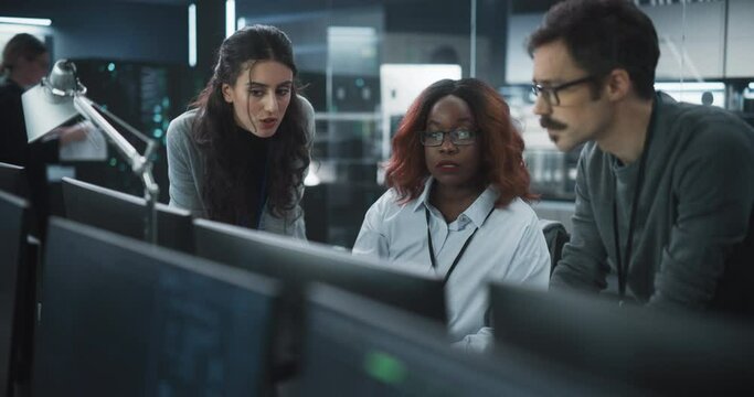 Team of Three Multiethnic Diverse Software Developers Talk, Discuss an AI Project. Empowered Black Female Specialists and Two Colleagues Work on Digital E-Commerce Startup Business