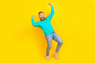 Fototapeta na wymiar Full body photo of attractive grandpa raise fists successful huge sales wear trendy aquamarine clothes isolated on yellow color background