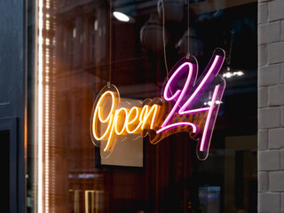 Glowing ad is OPEN 24 hours a day in cafeteria window. Modern electric signboard to attract...