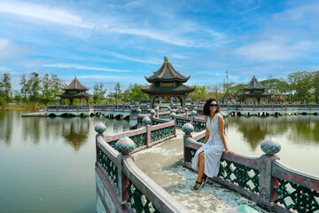 Beautiful brunette girl in front of Ancient Siam Ancient Siam is a park built under the patronage...