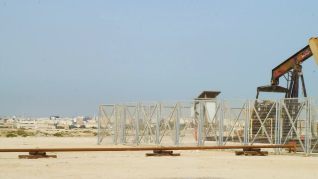 Oil pump in the desert by the American University of Bahrain