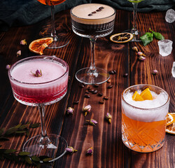 different colorful exotic alcoholic cocktails on wood