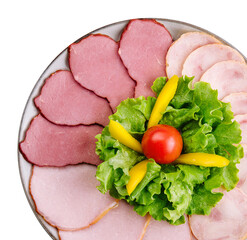 Fresh sliced sausage on plate top view