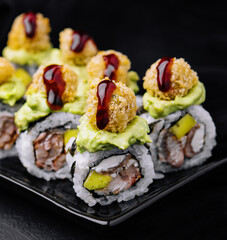 set of rolls on stone serving board