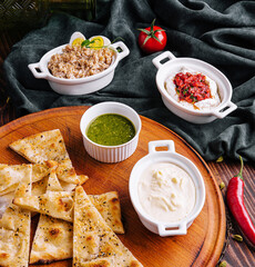 Italian focaccia bread with antipasti, top view