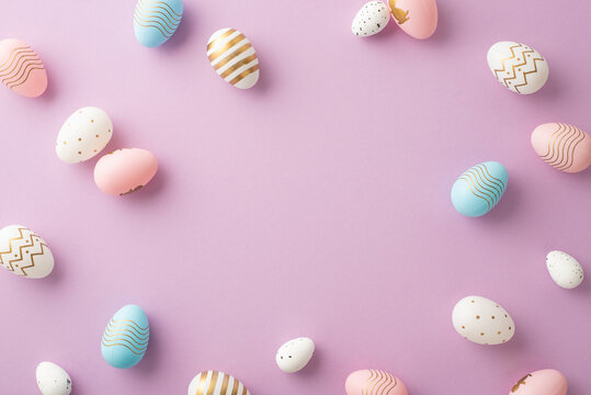 Easter Celebration Concept. Top View Photo Of Blue Pink White And Gold Easter Eggs On Isolated Pastel Violet Background With Copyspace In The Middle