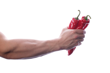 Strong fit muscular male holding paprika in his right hand transparent PNG