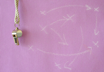 Whistle of soccer referee or trainer and soccer tactics scribble on pink background. Women's soccer...