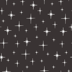 Seamless pattern with hand-drawn stars in boho style. Vector
