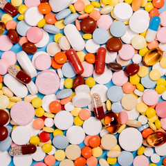 Many colorful different medicines and pills on top. The concept of medical treatment