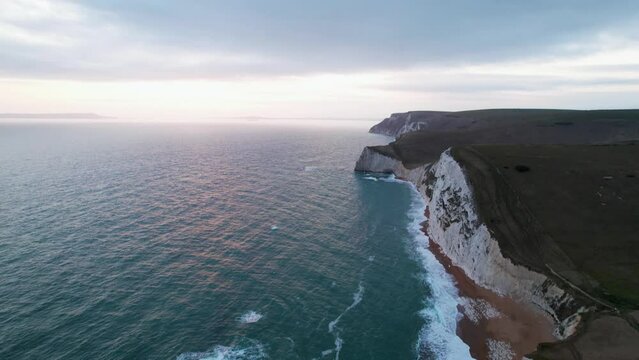 Durdle Door - Flying along the coastline over the white cliffs 