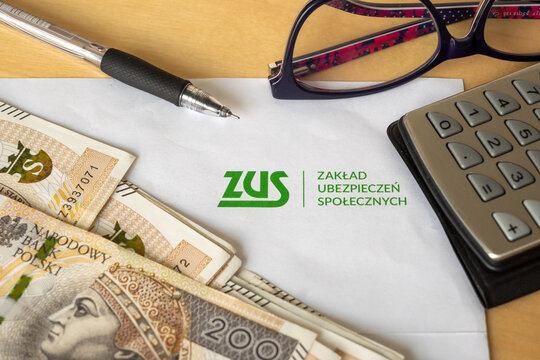 Gdansk, Poland - March 3, 2023: ZUS (National Social Insurance Company) logo on a sheet of paper and polish money