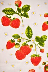 Strawberries with flowers and leaves on fabric, good photo for background
