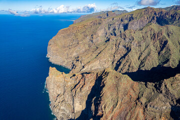 Aerial view above the impressive mountains and cliff of Los Gigantes in Tenerife Canary Islands