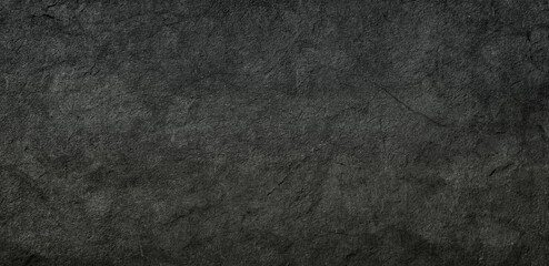 black concrete wall , grunge stone texture , dark gray rock surface background panoramic wide banner 
