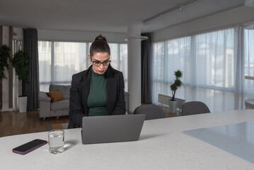 Young freelancer woman expert webmaster web designer and developer working from home on a new...