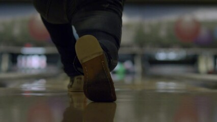 Man throws a bowling ball and gets 9 pins