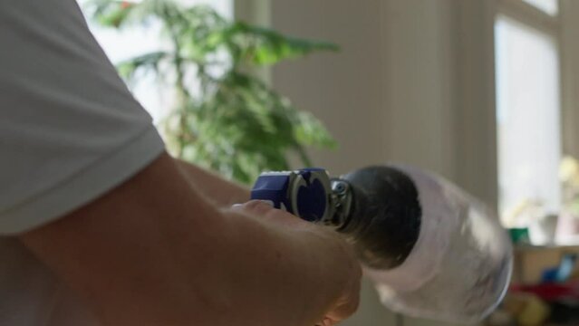 Handyman working on a leg prosthesis for a human person