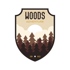 Woods logo vector design with trees nature landscape. Camping badge graphics in retro style. Travel colorful emblem. Stock vector adventure label isolated