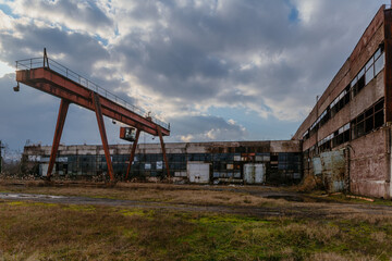 Fototapeta na wymiar Industrial area, old shabby abandoned industrial buildings