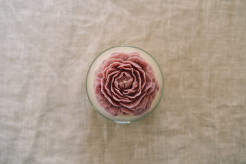 Candle in the shape of a rose. Сlose up