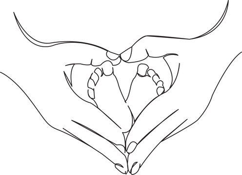 newborn feet in mother's hands