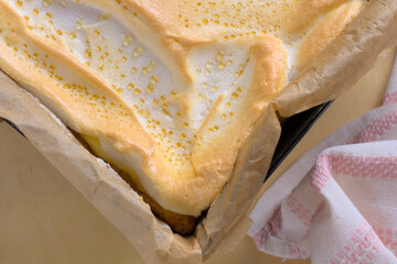Top view of homemade freshly baked cheesecake with dew. Appetizing background showing a close-up of...