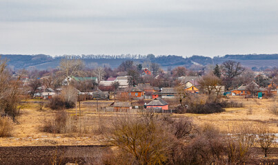 Village and rural houses in the countryside in Ukraine in autumn and winter. Vegetable gardens and...