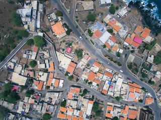 Aerial photos of Cidade Velha in Santiago, Cape Verde, reveal a historic town with a stunning coastline, a UNESCO World Heritage Site, showcasing colonial-era architecture, picturesque streets.