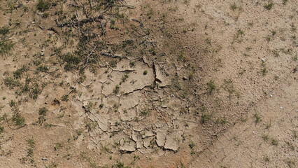 Climate change drought land. Global warming issue, cracked mud in the bottom of a river