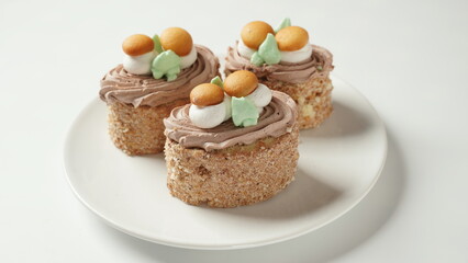 Biscuit-cream cakes decorated with cream flowers and Mushrooms