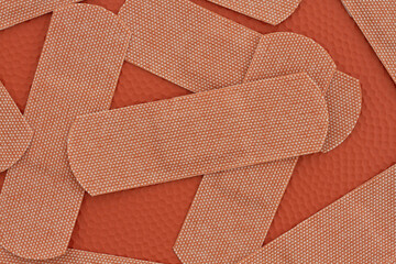 Lots of fabric adhesive band aids background