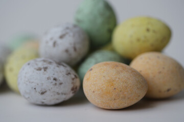 Fototapeta na wymiar Colourful chocolate eggs with spots to celebrate Easter.