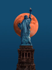 Statue of liberty in new york city usa in front of giant red moon © Trilly