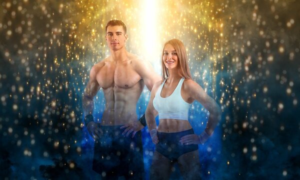 Fit couple at the gym. Fitness concept. Healthy life style. Sports wall paper for fitness gym advertising. Picture for a sports article in a magazine, website.